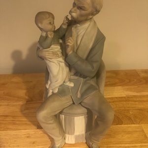 Man and baby lladro